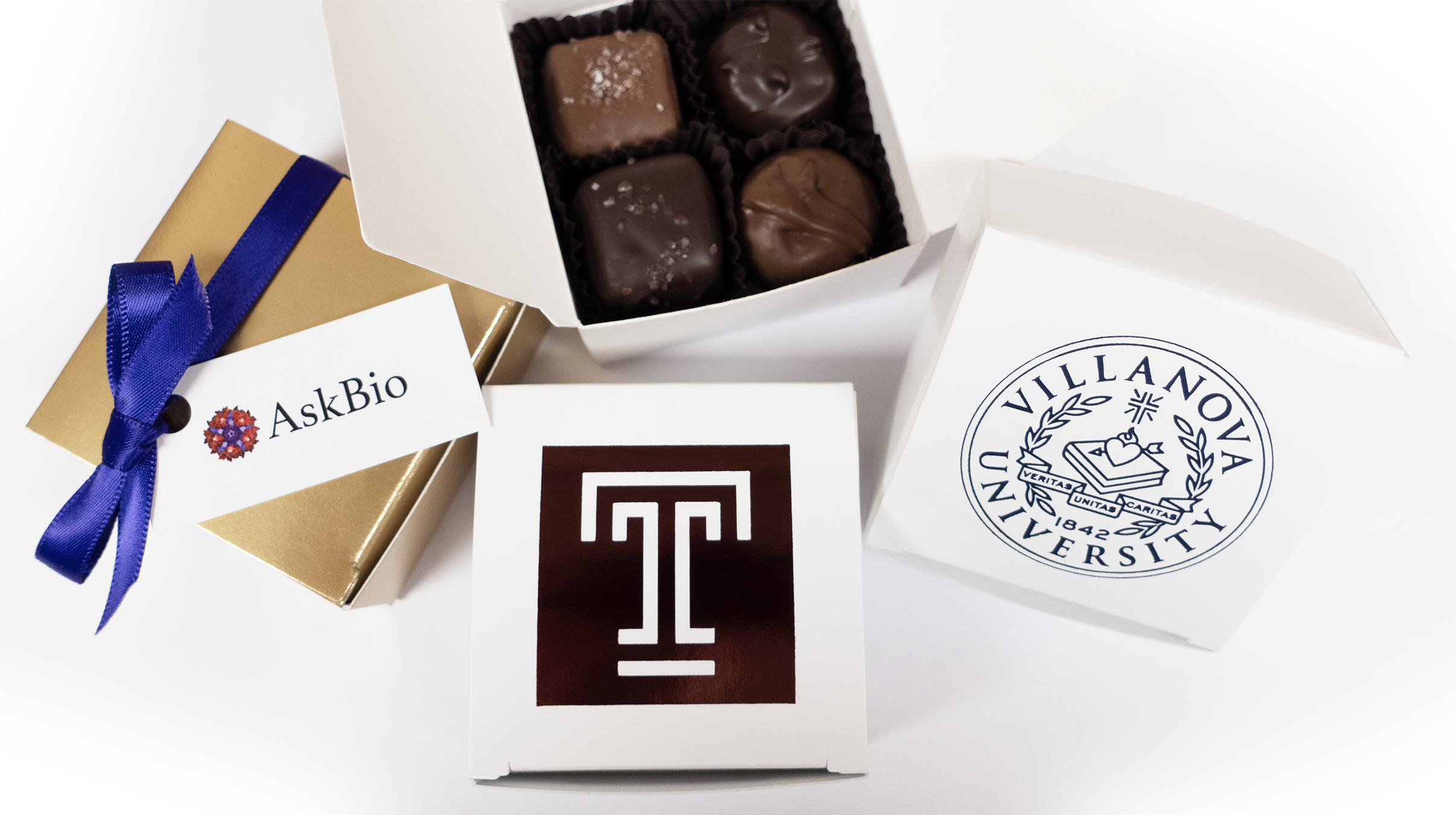 Custom boxes, chocolates, and hang tags, for promotional or referral gifting