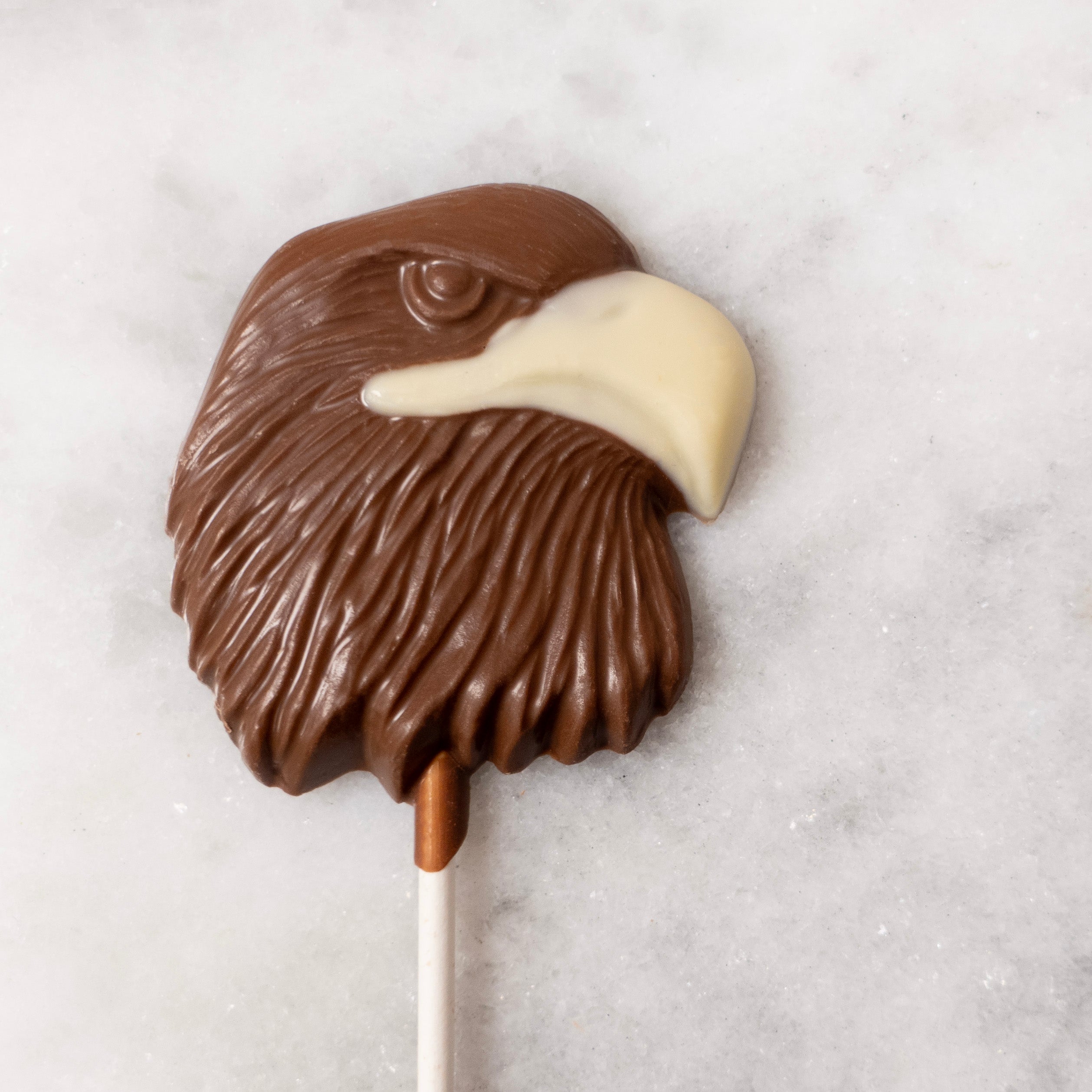 Milk Chocolate Eagle Head with a White Chocolate Beak on a lollipop stick