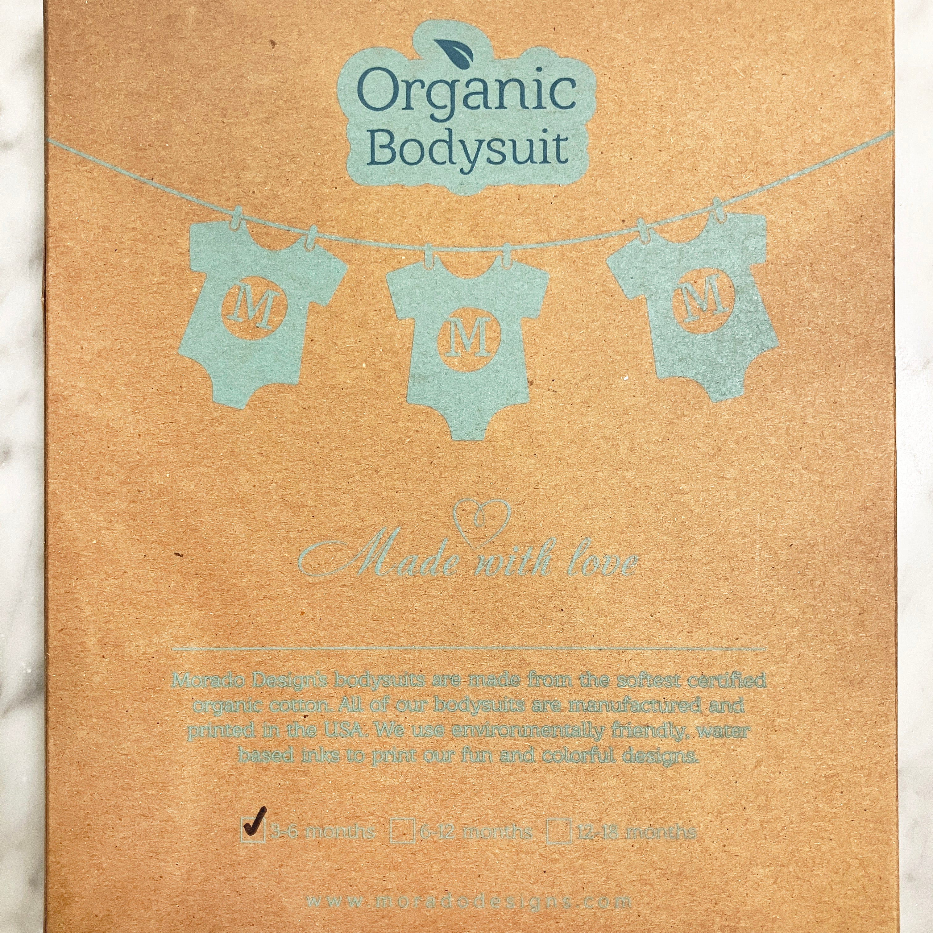 Package of Organic Bodysuit with text on a brown background