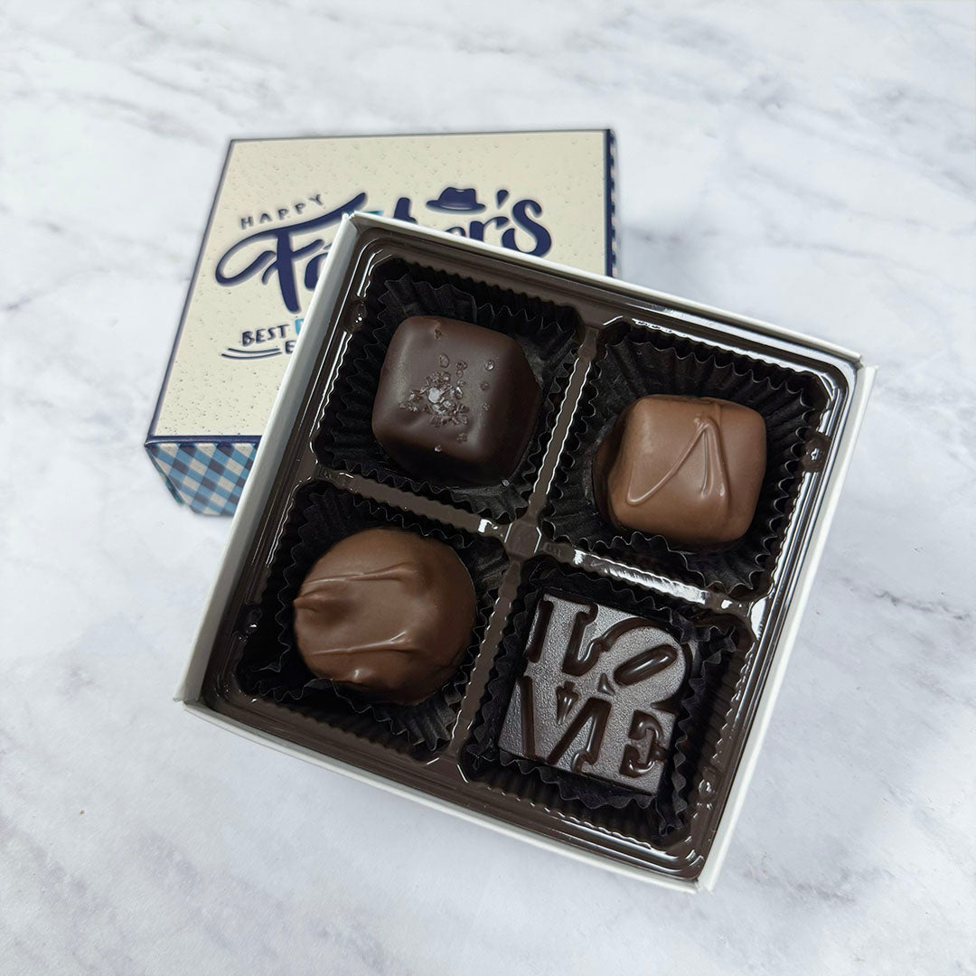 Gift Box of chocolates with 'Happy Father's Day' design on a white background - detail of chocolates, sea salt caramel, vanilla caramel, solid LOVE, and vanilla butter cream - made by Lore's Chocolates in Philadelphia