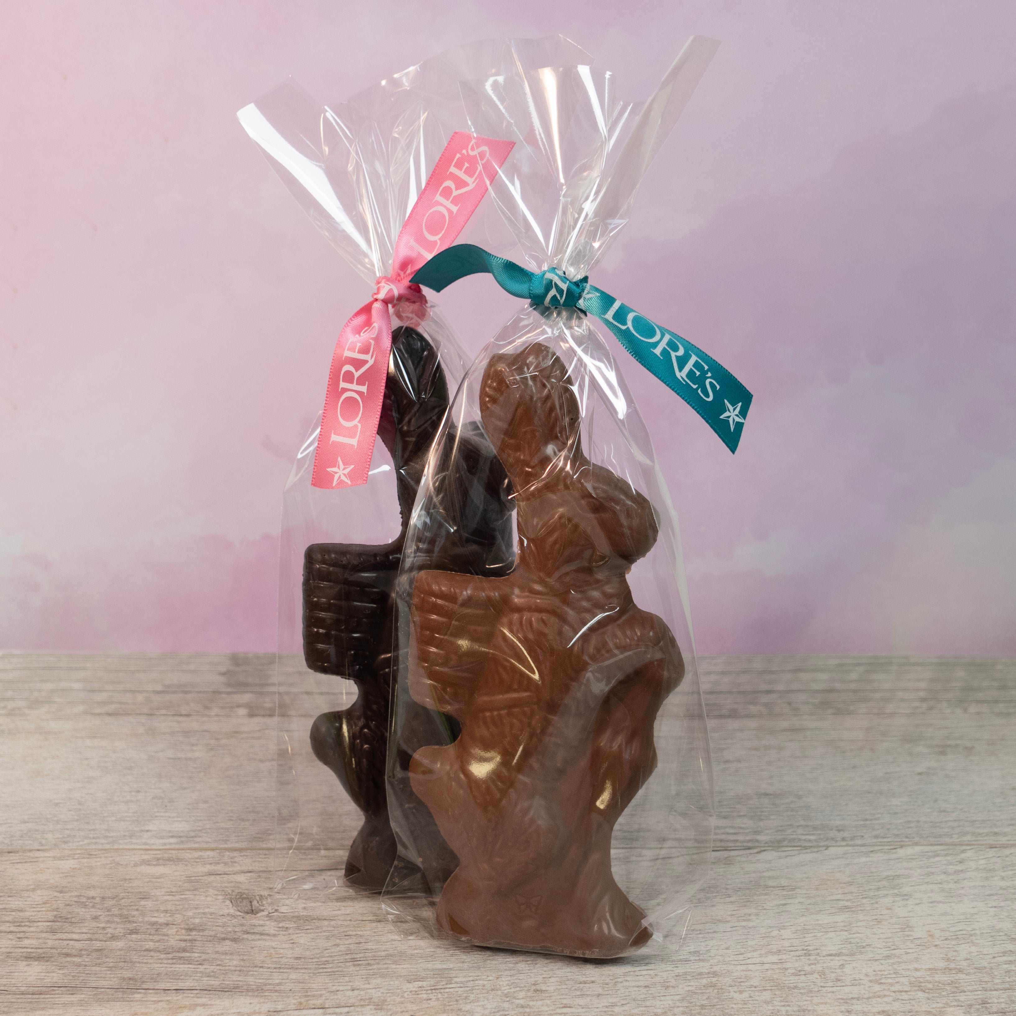 packaging of Milk and Dark Lore's Chocolates parasol 5 oz solid chocolate easter bunny