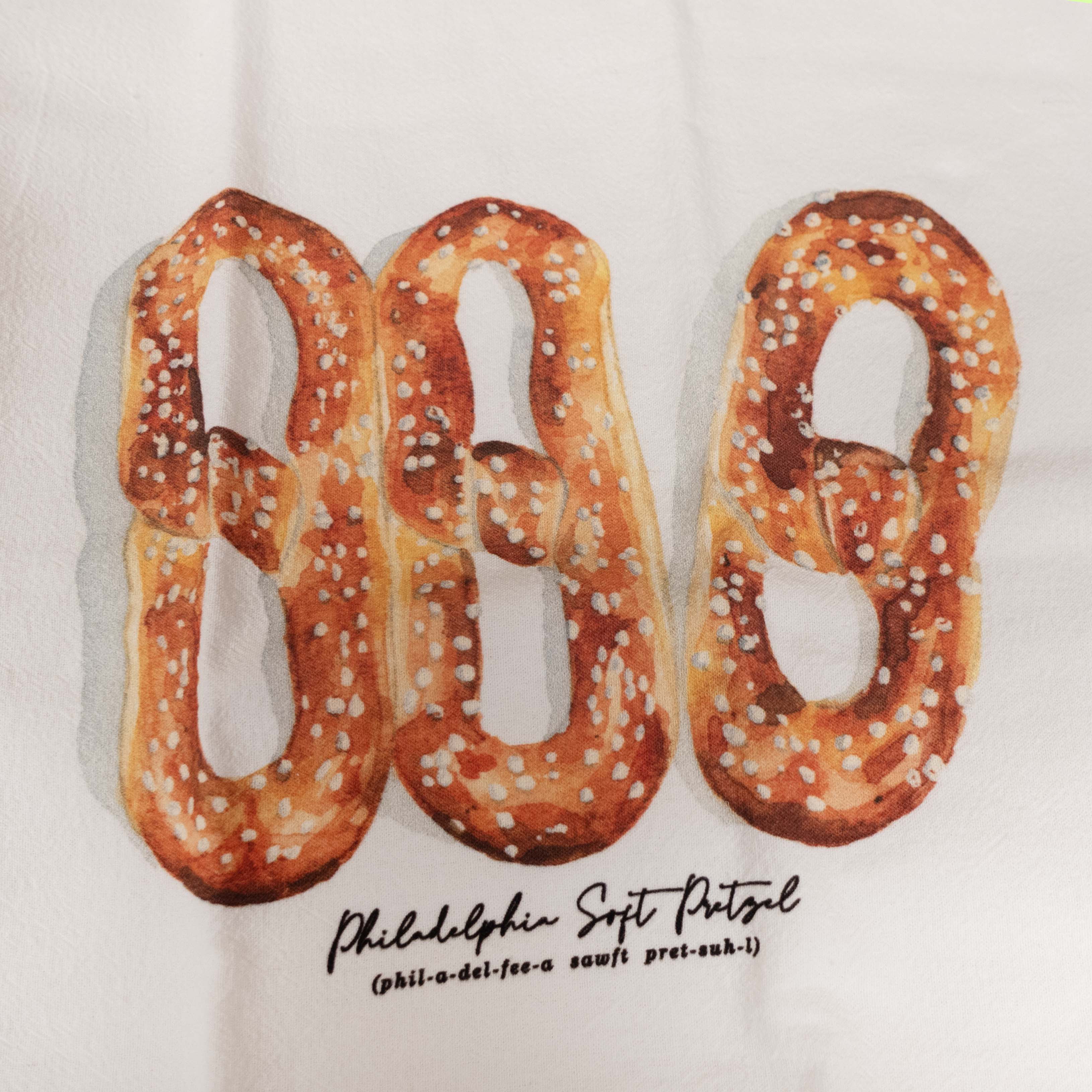 Three soft Philadelphia pretzels on a white background with 'Philadelphia Soft Pretzel' text.