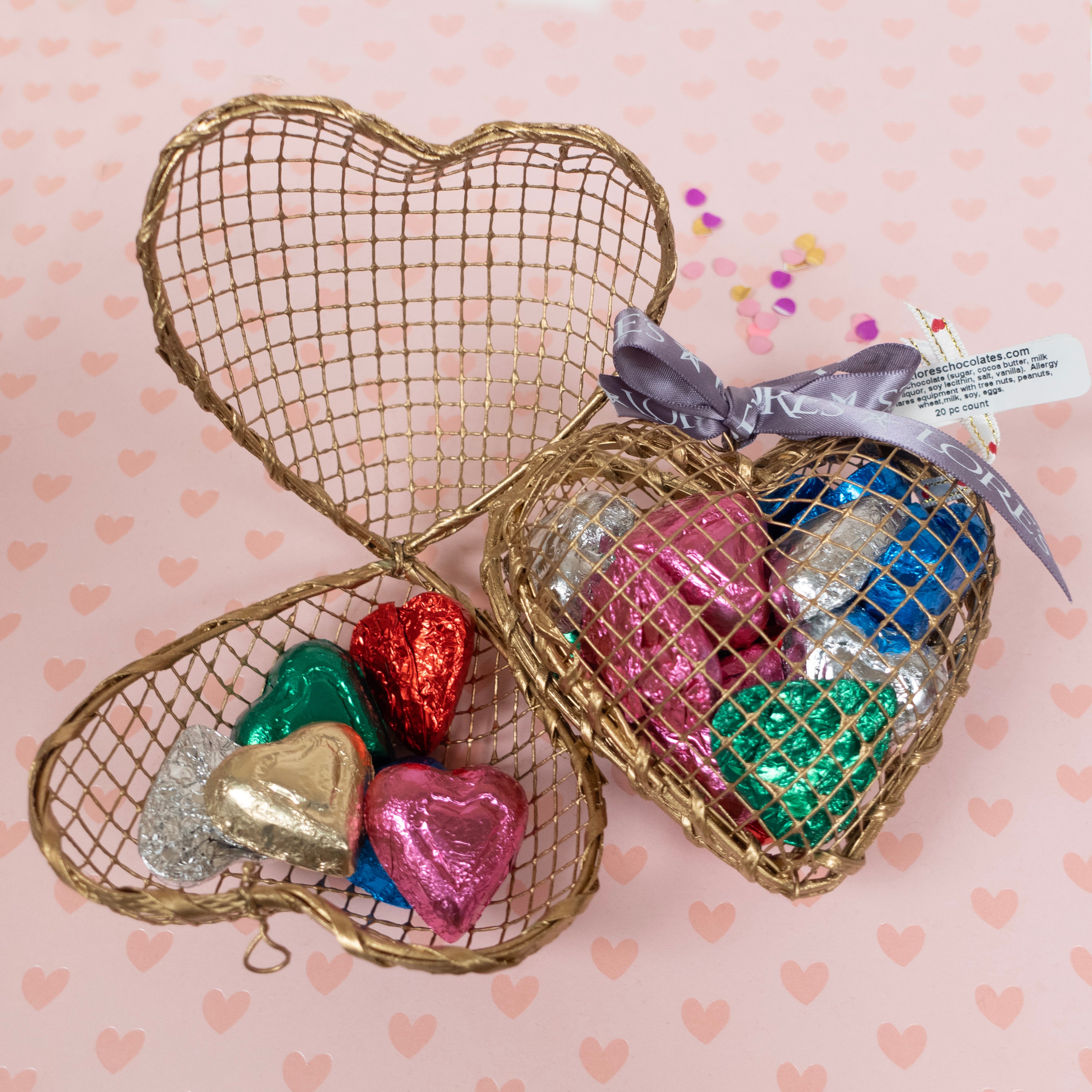 open and shut gold wired cages full of foiled milk chocolate valentines day hearts