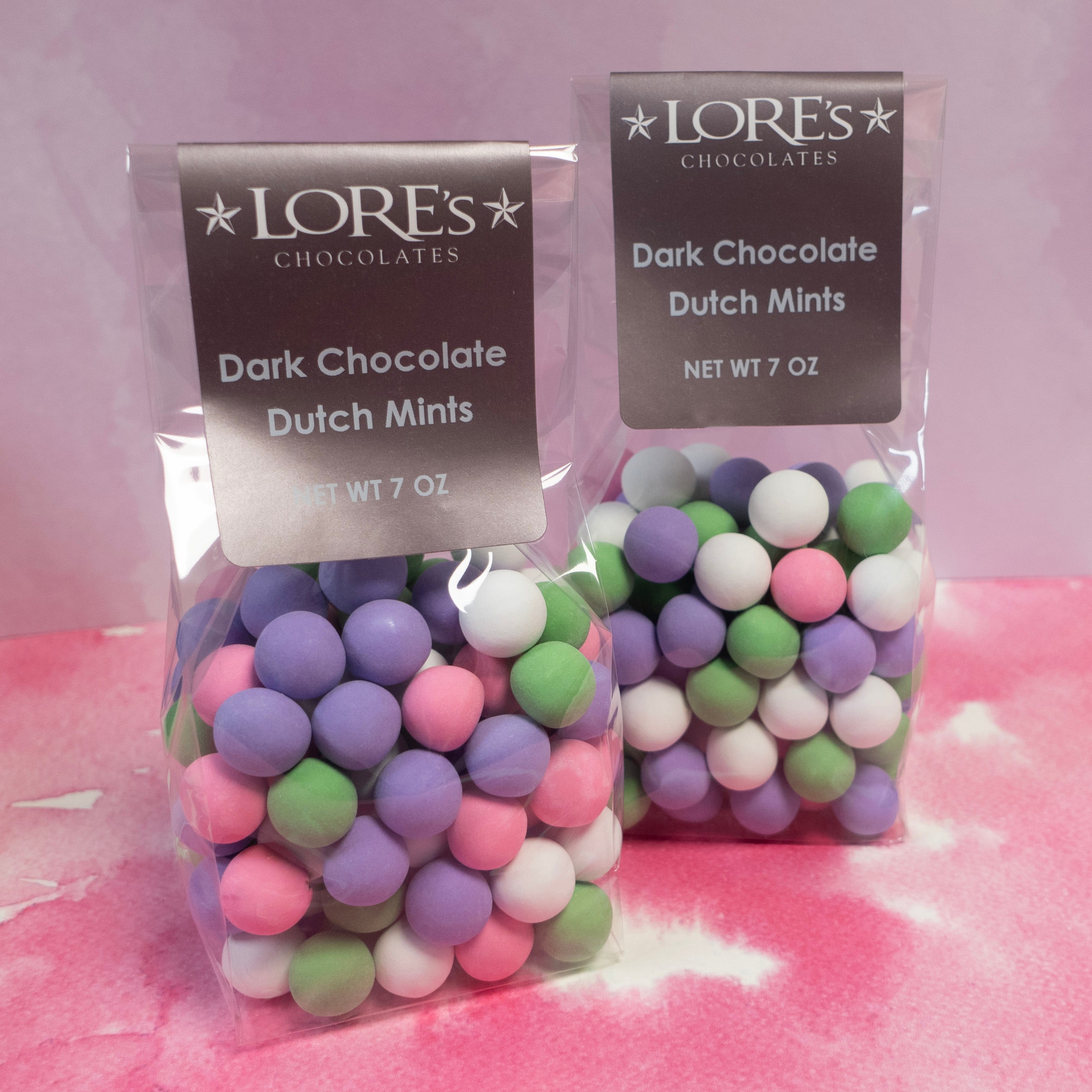 round balls of mint candy dark chocolate - purple, pinks, green, and white colors 