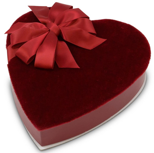 red velvet heart box decorated with a red satin bow-chocolate selection is assorted milk and dark