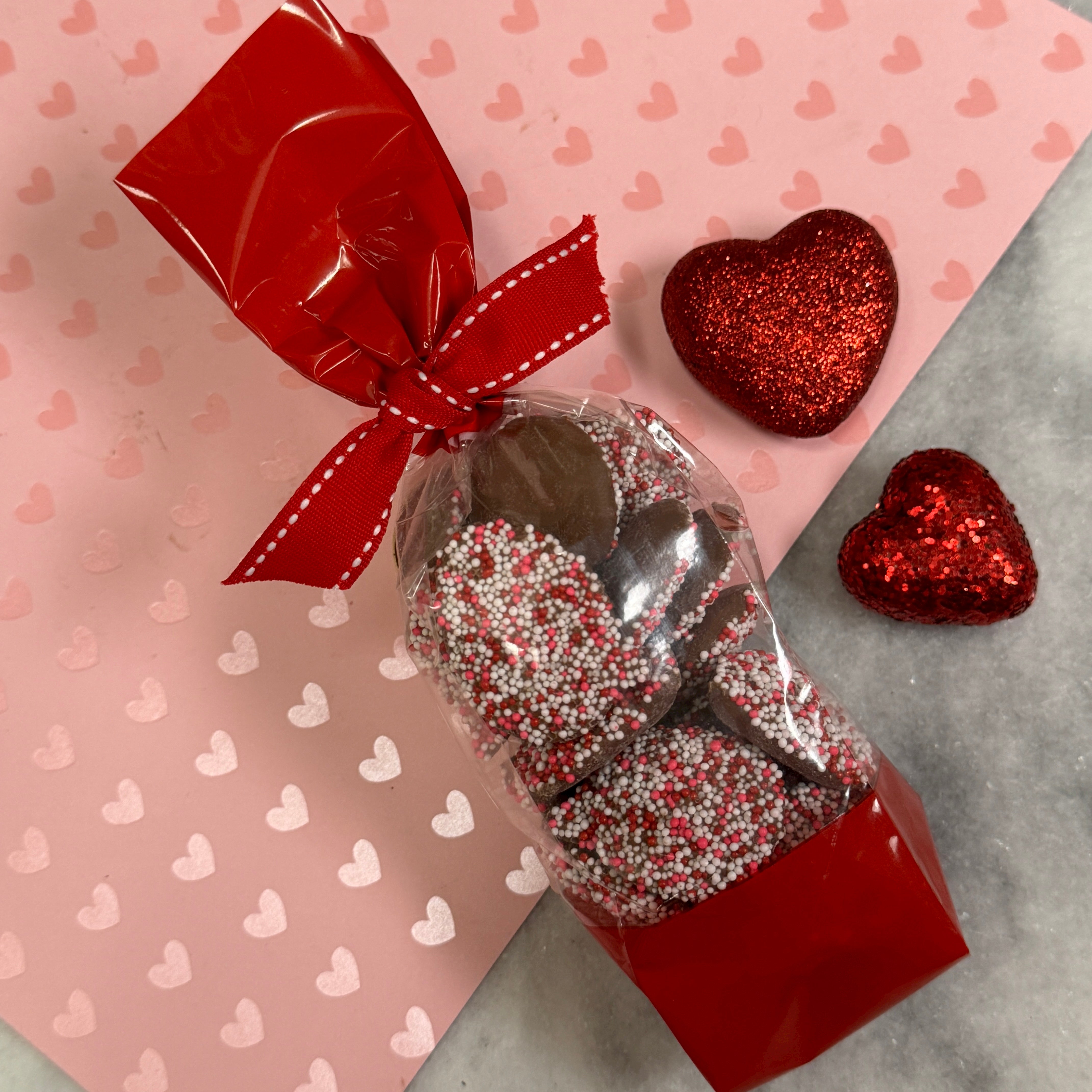 Red white and pink seeds decorate chocolate non pareils