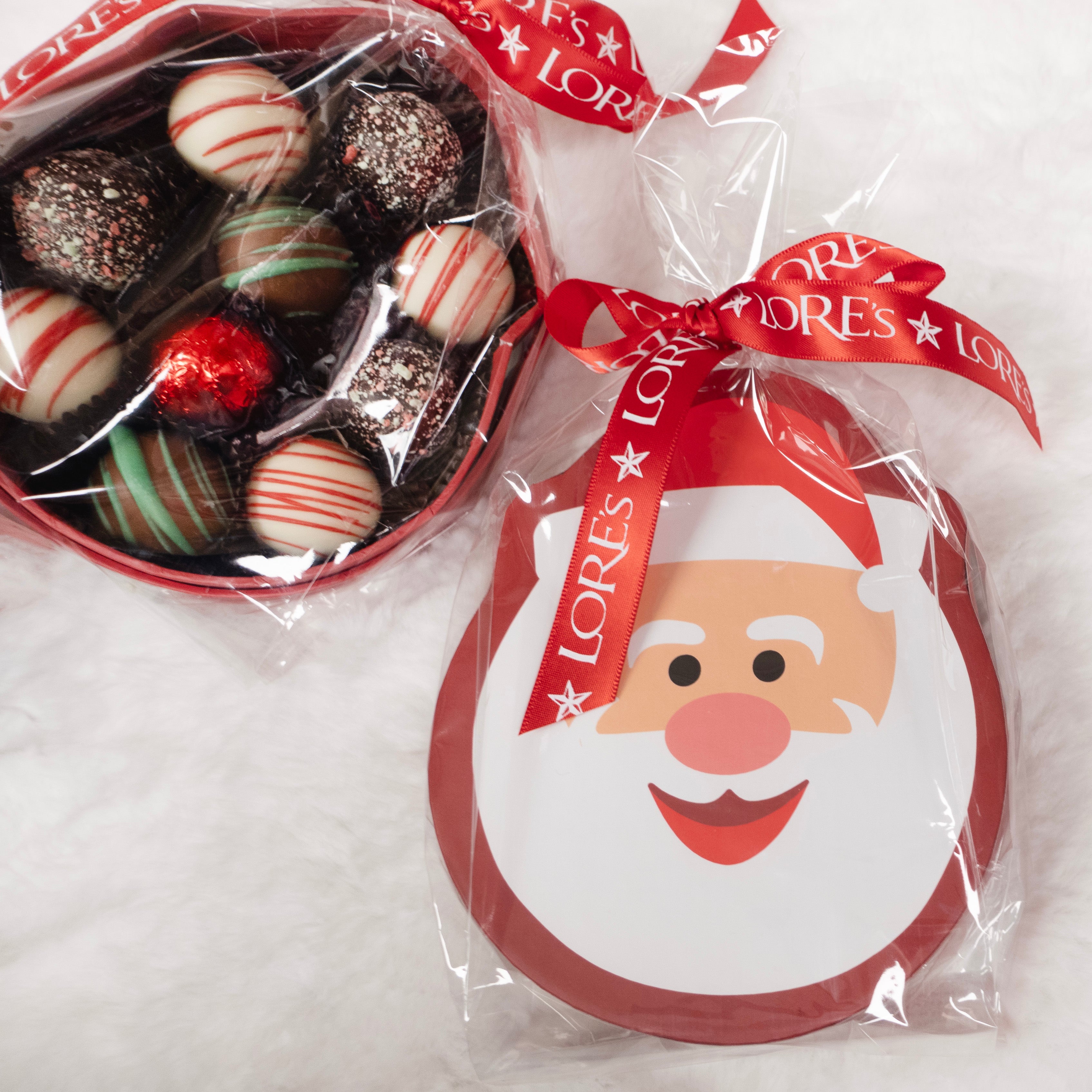 Detail on Truffles included in Santa Box for Christmas - Peppermint Candy Cane, Egg Nog, Irish Cream, and a red foiled milk chocolate truffle