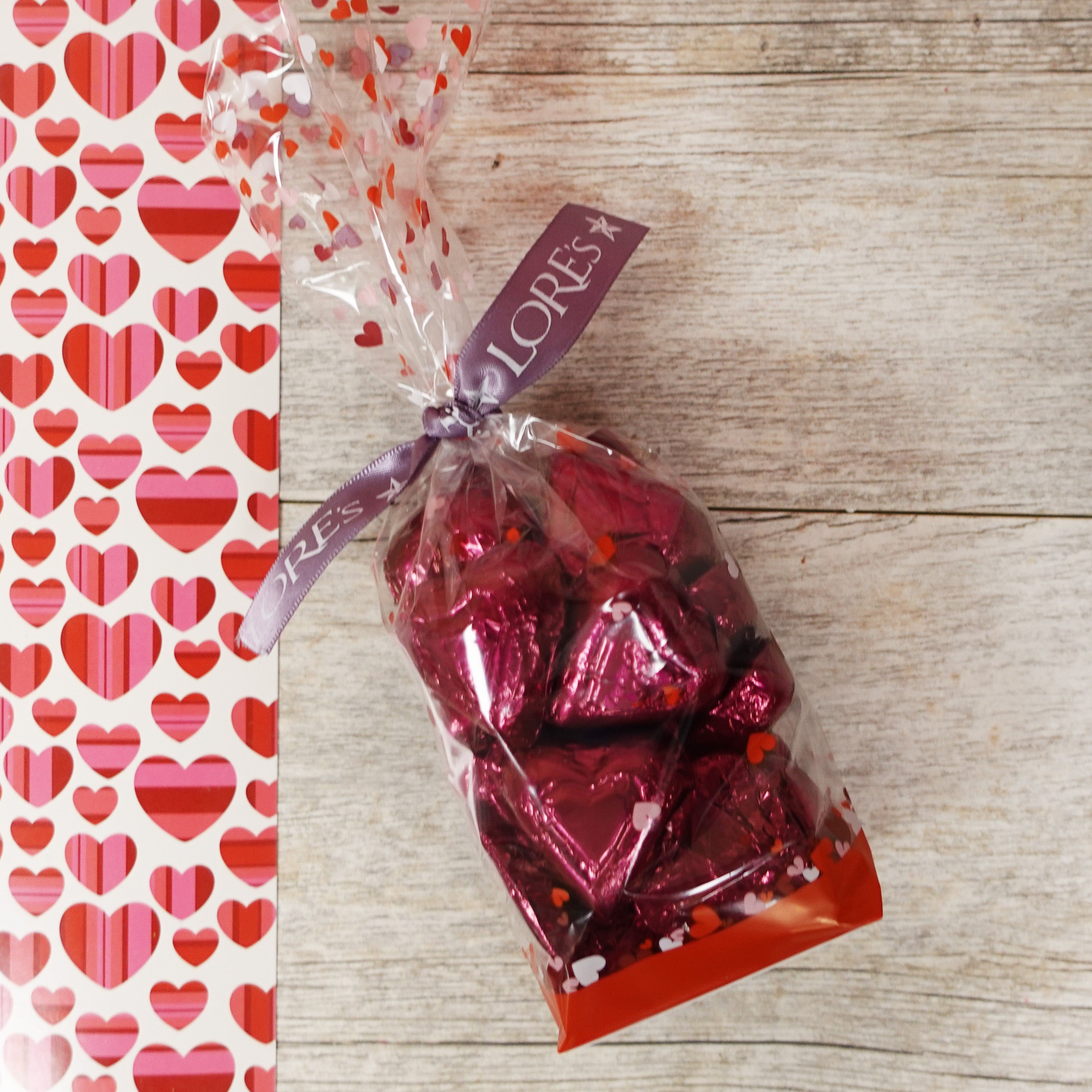 dark red foiled 72% dark chocolate hearts in cello valentine's day bag with Lore's Chocolates Purple Ribbon