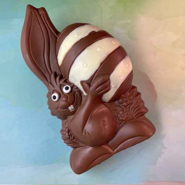 MIlk Chocolate Easter Bunny-Bunny holding an Easter Egg- decorated with white chocolate-semi solid -about 7 inches tall