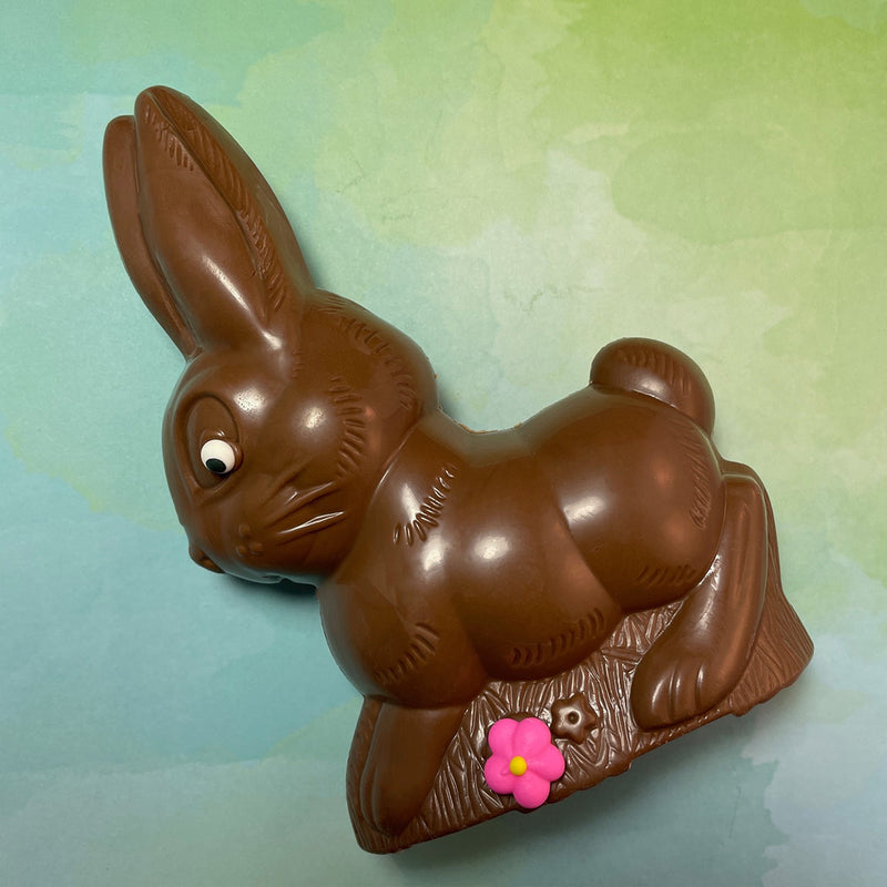 Milk Chocolate bunny-semi solid -decorated with a royal icing flower-semi solid-about  7 1/2 inches tall