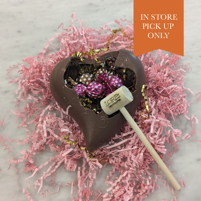 chocolate heart - paisley design -filled with raspberry and caramel truffles -sealed closed and ready to be 'broken into'- wooden Lore's hammer  included.
