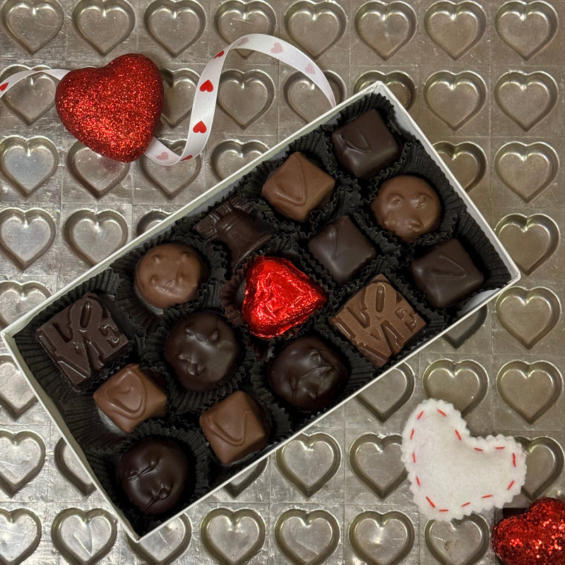 Vanilla Caramels, Vanilla Buttercreams in both milk and dark chocolate, our LOVE and Liberty Bell bite-sized chocolates, and a milk chocolate foiled heart.