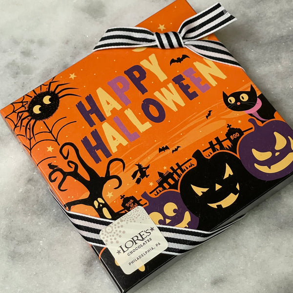 Outside of decorative box orange with halloween decor reading "Happy Halloween"