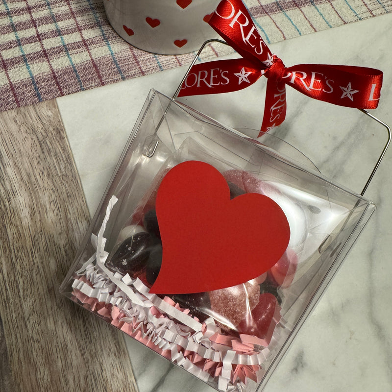take out box decorated for Valentines day-contains assorted heart chewies and foild chocolate hearts