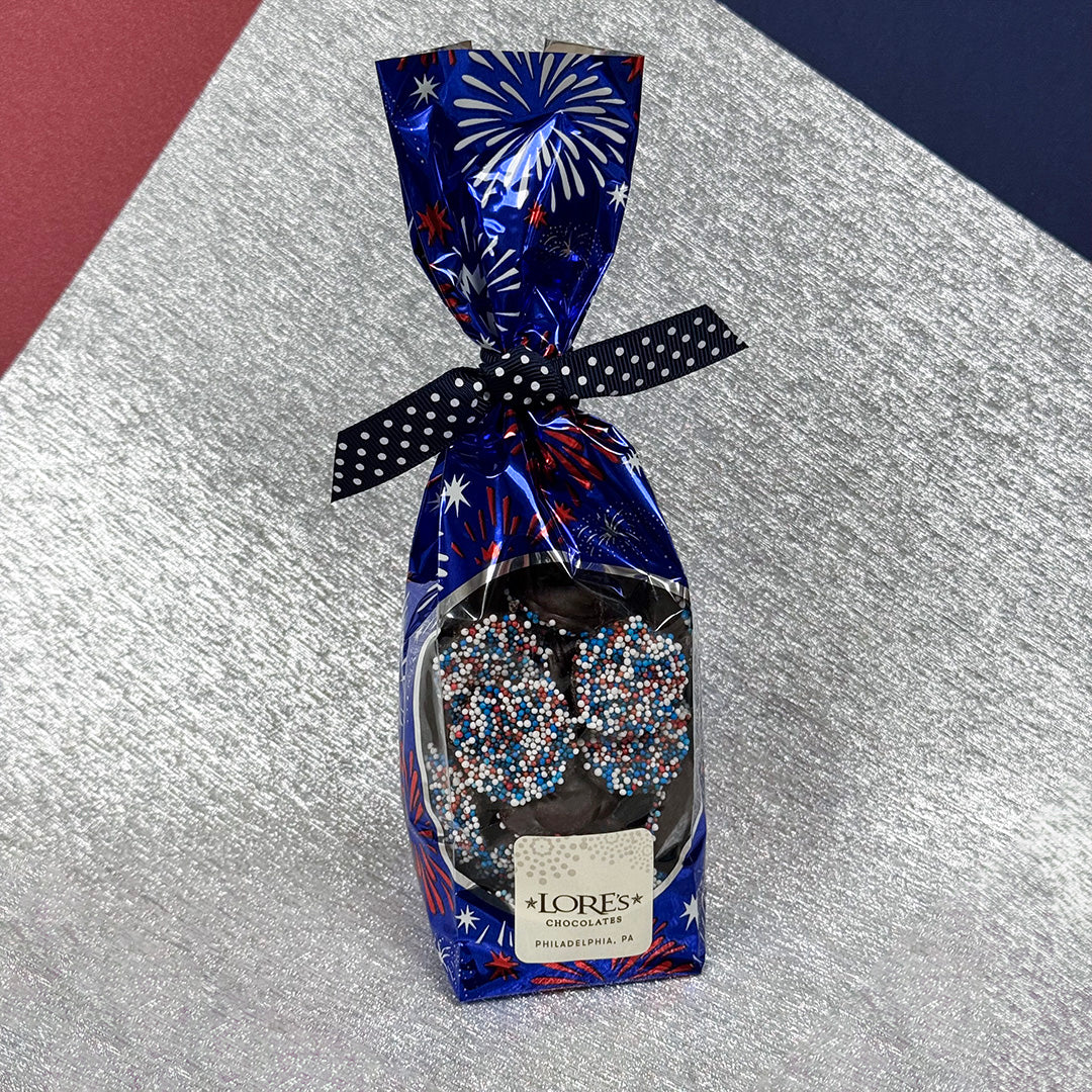 Chocolate gift bag of patriotic nonpareils with festive design on a metallic surface -  Lore's Chocolates in Philadelphia