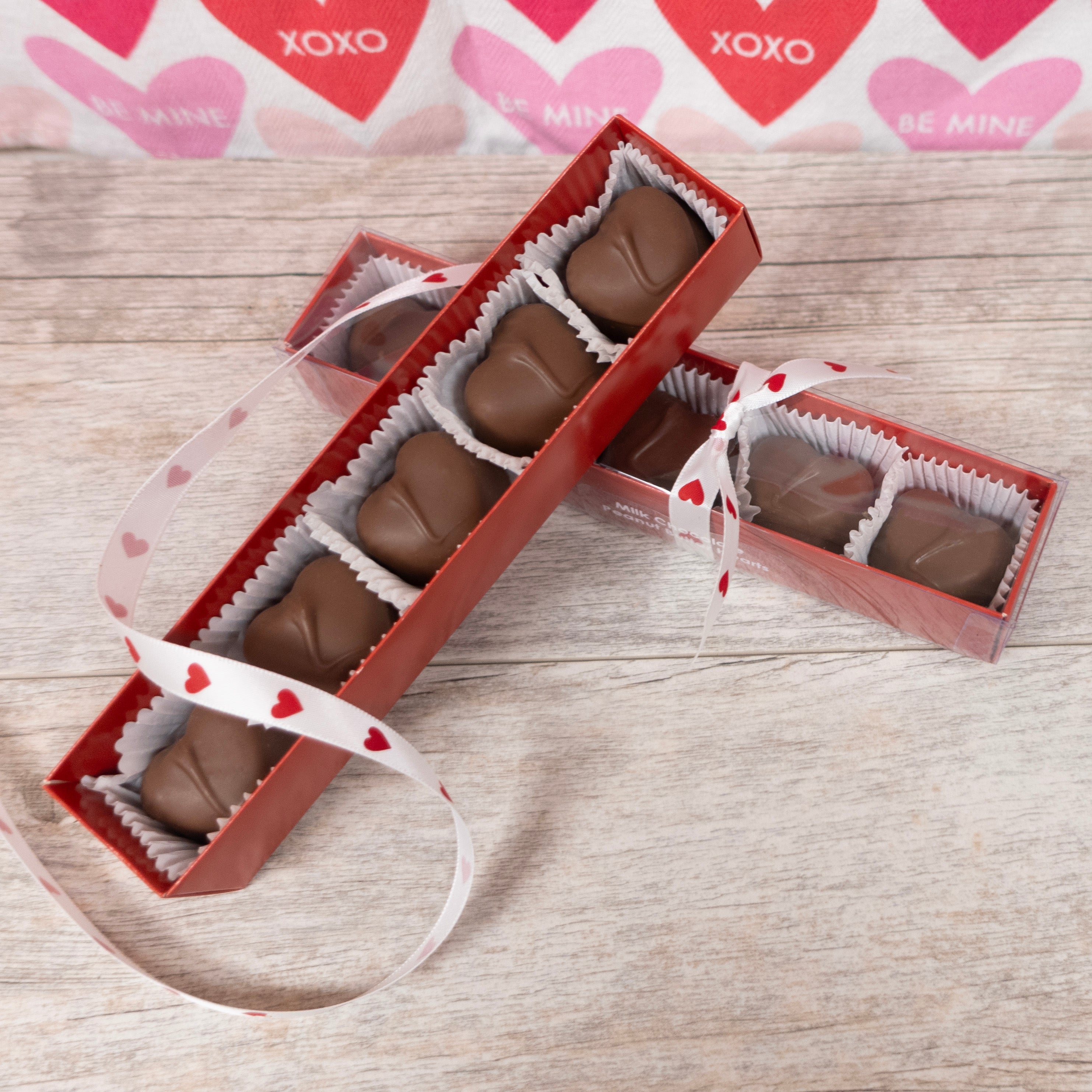 Lore's Chocolate's milk chocolate peanut butter bites in heart shapes for Valentine's Day - packaged in red rectangular box with clear lid