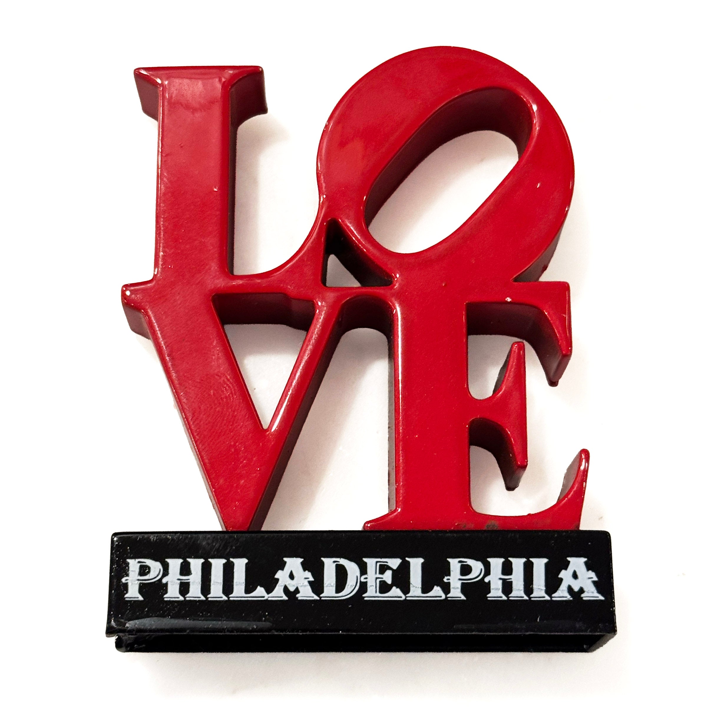 Red 'LOVE' sculpture with 'Philadelphia' on a white background