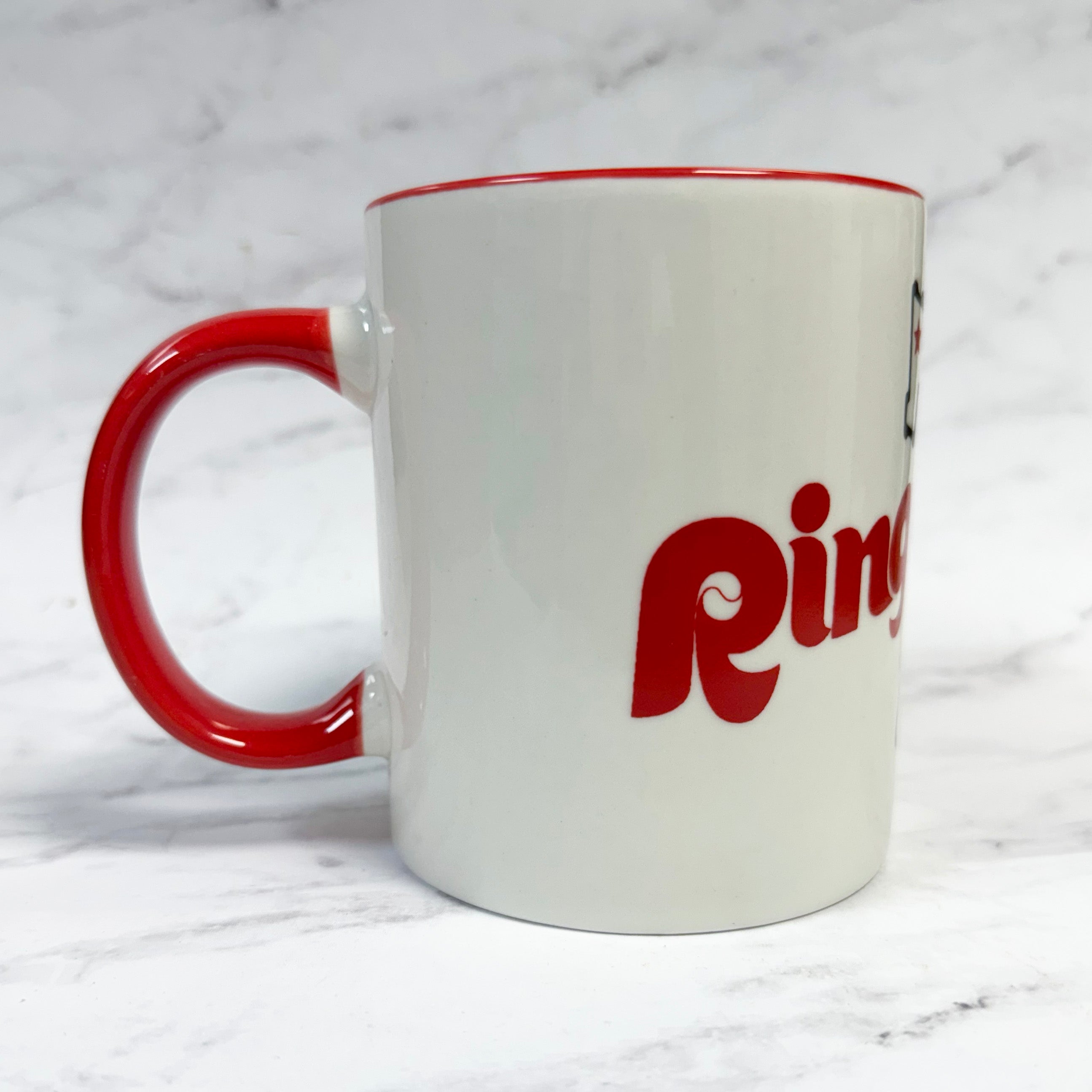 ring the bell - White mug with red handle and 'Ring' logo on a white background