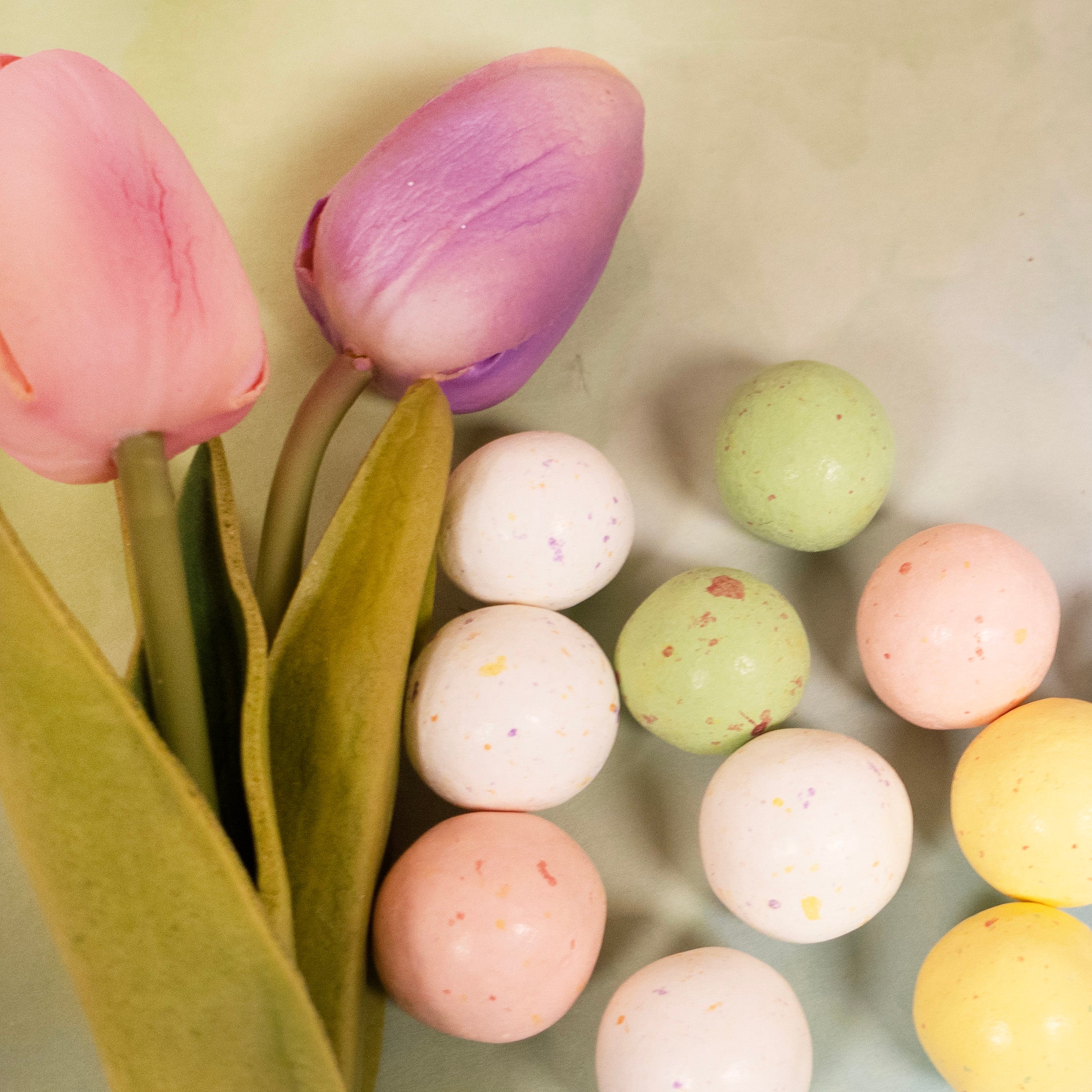 close up of malted ball easter eggs with pastel colors and speckled design