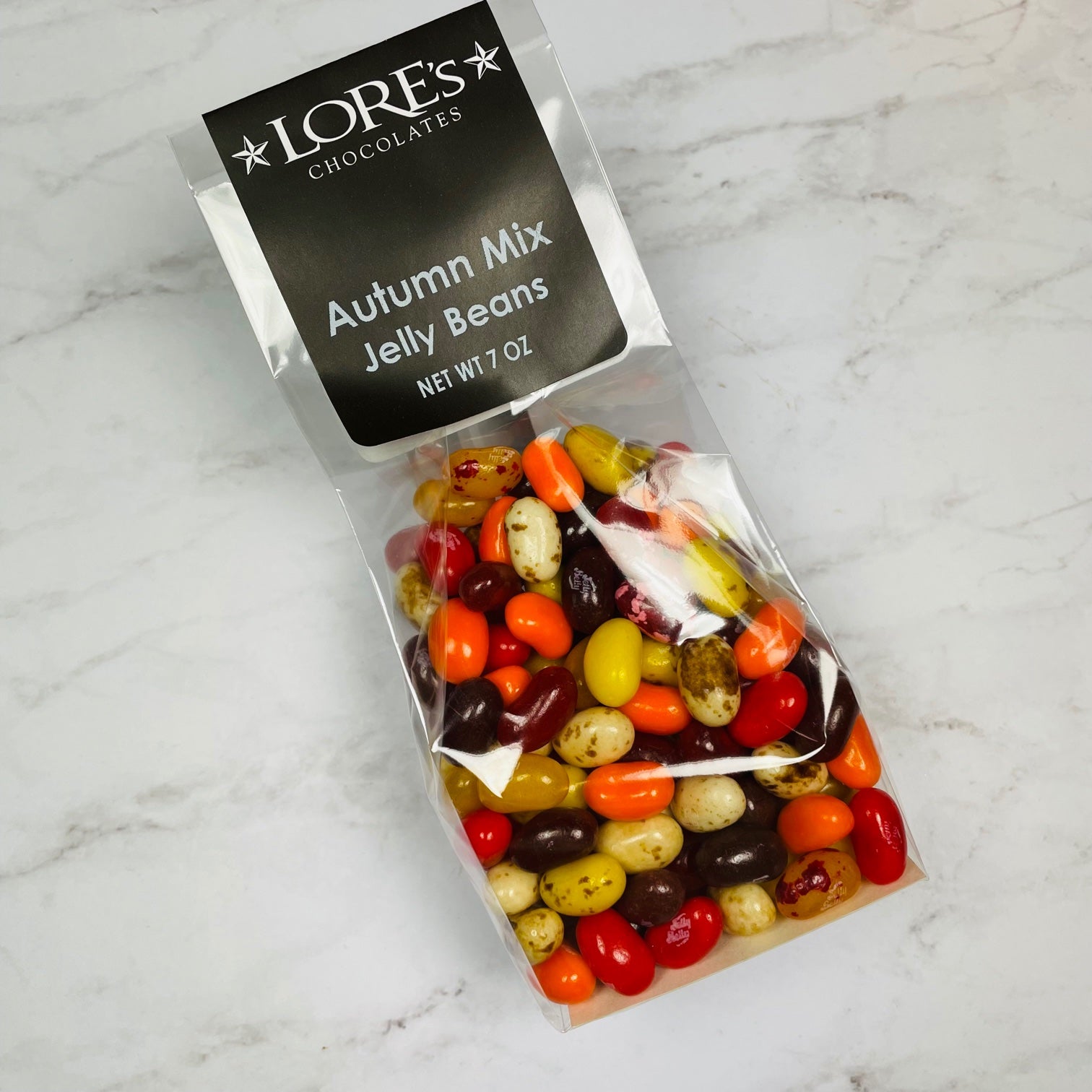Vibrant fall colors shown in an assorted autumn mix of jelly beans - colors: red, orange, brown, beige, cream, and maroon
