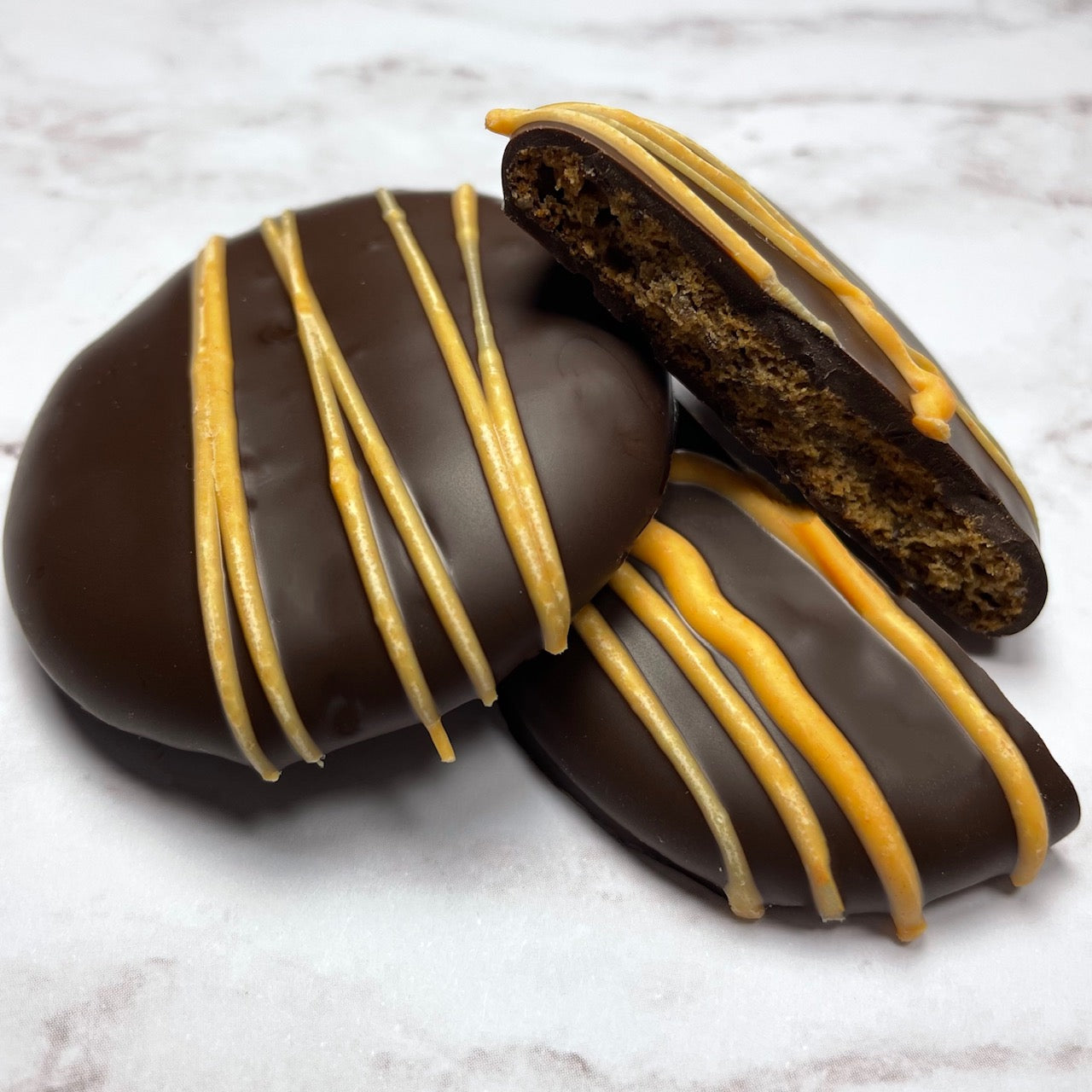 The best Dark Chocolate Crunchy Spice Wafer Cookies - with a orange colored drizzle