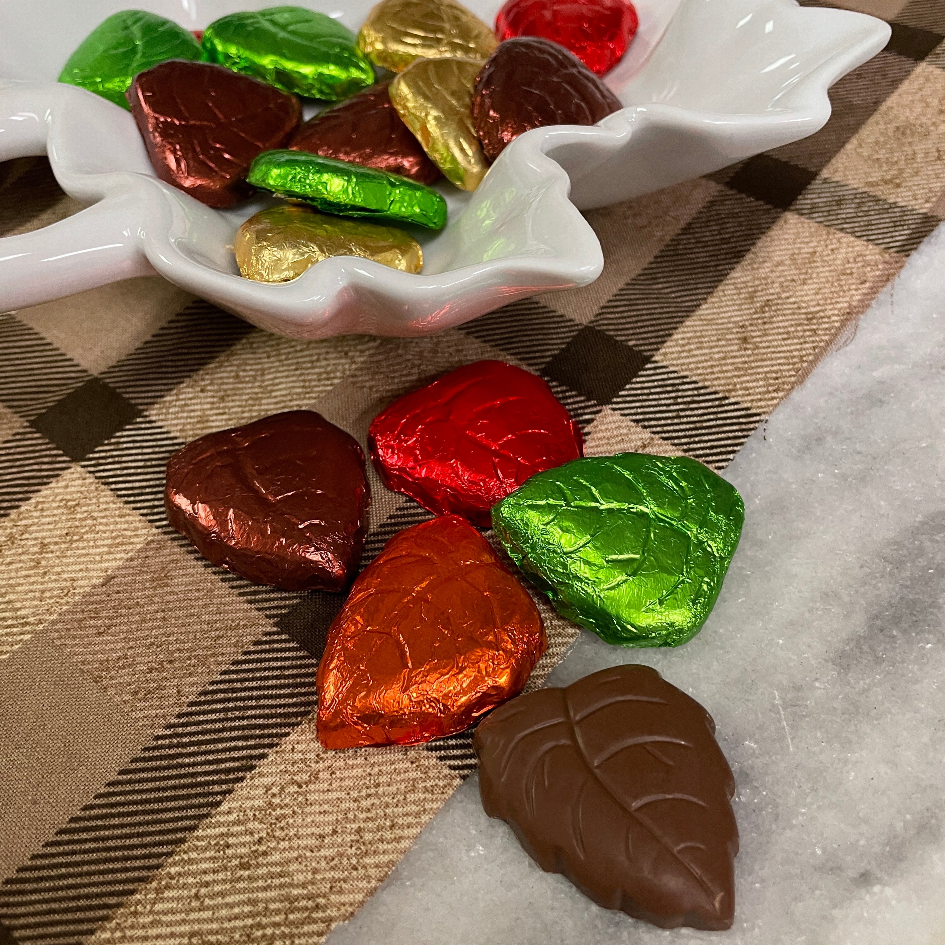 Solid Milk Chocolate Leaves, folied in red, orange, gold, brown, and green.