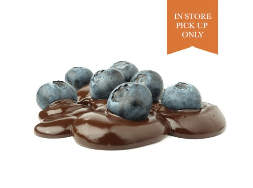 Fresh blueberries sitting on delicious melted chocolate from Lore's in Philadelphia. 
Flag in top right of image reads "In Store Pick Up Only"